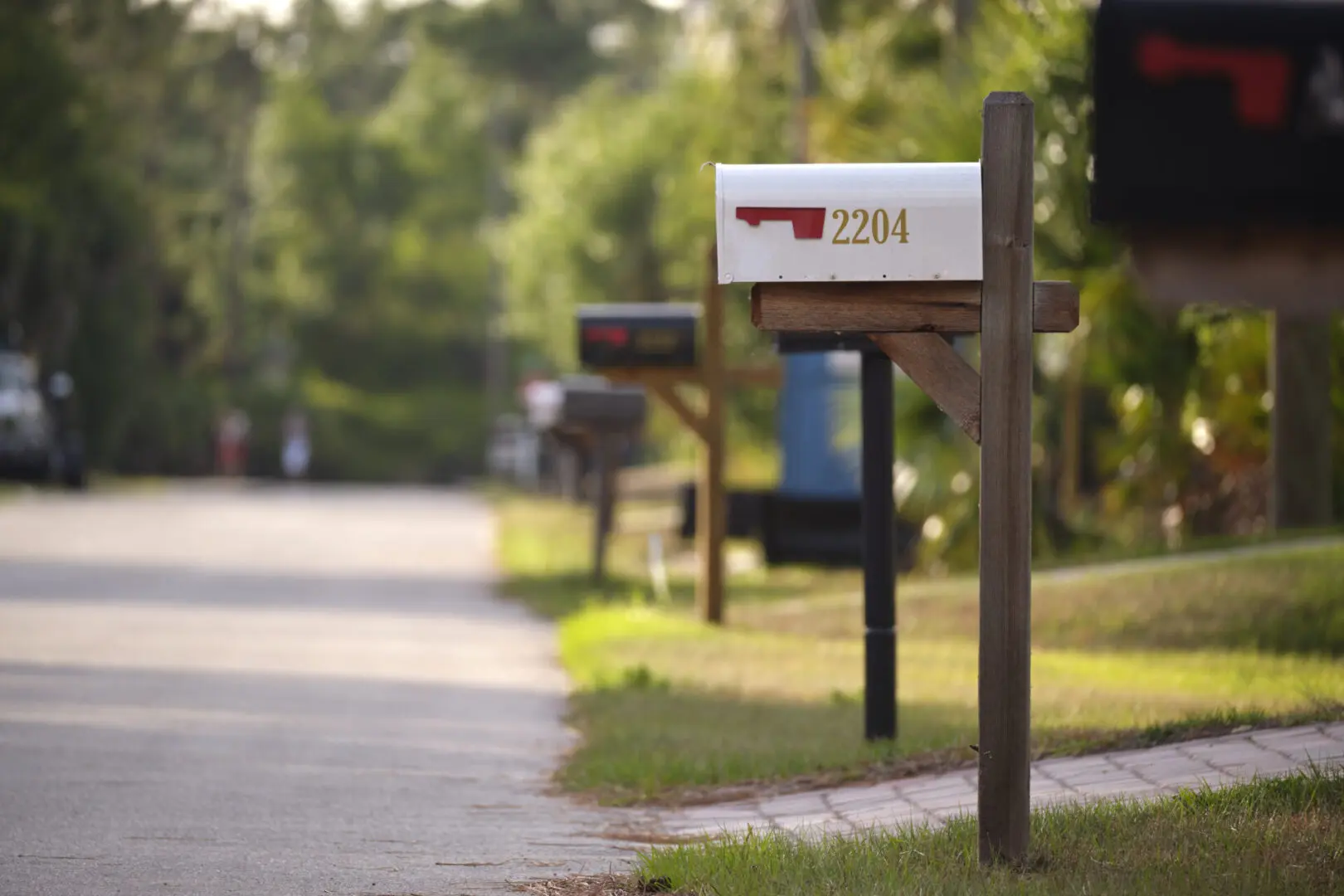 Typical american outdoors mail box on suburban street side.
